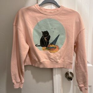 Meow Wolf pink crop top sweater